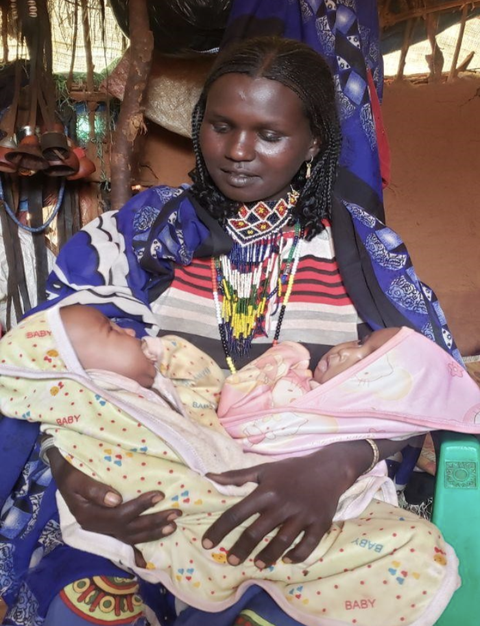 Woman holding a baby in Ethiopia